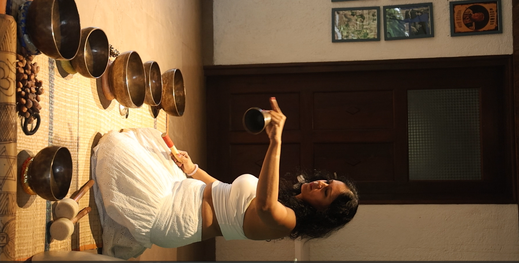 Practitioner leading a Tibetan singing bowl sound healing session